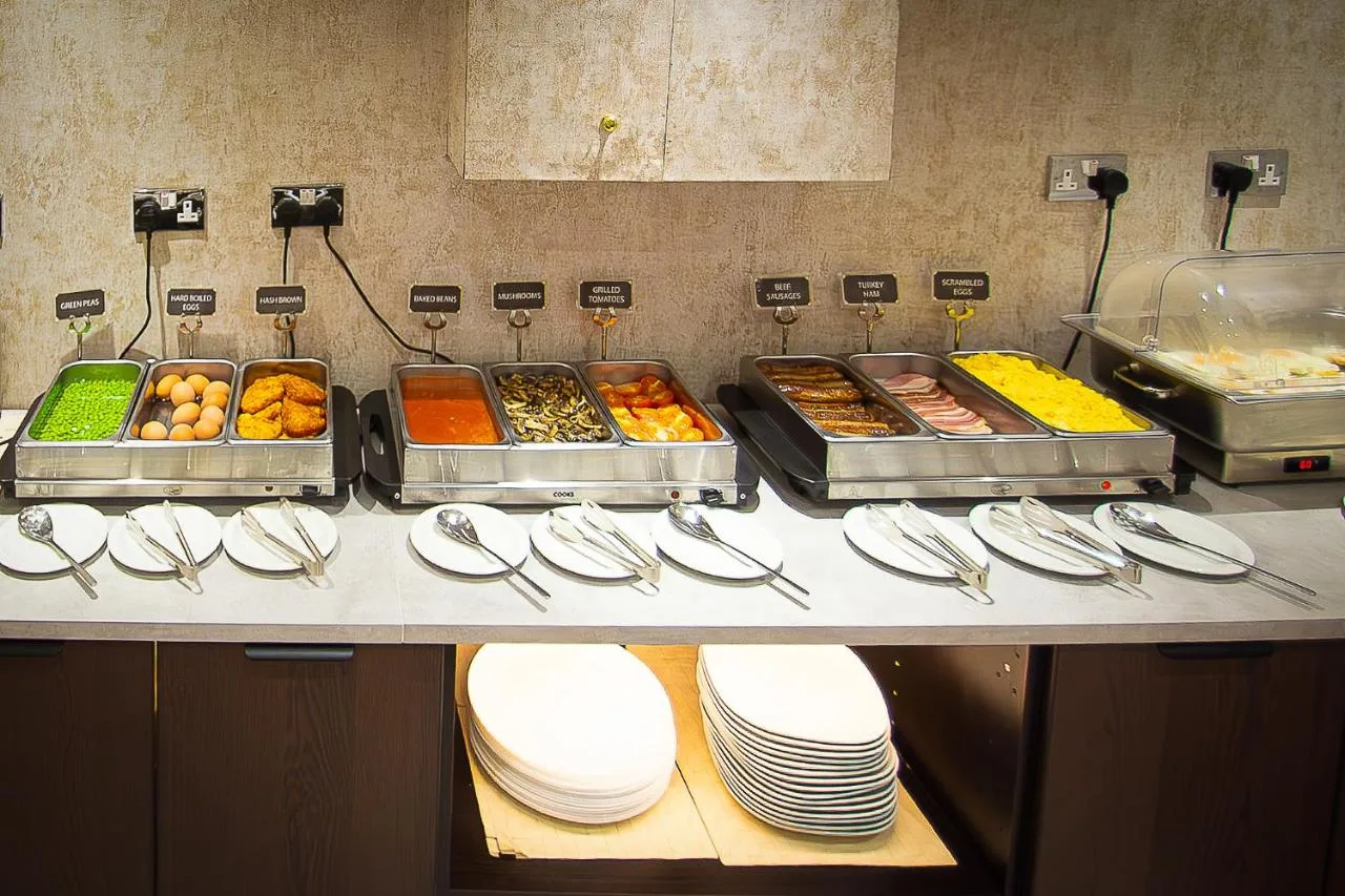 a buffet line with many different types of food at Hyde Park International, Bayswater